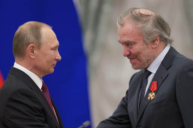 Vladimir Putin presents a medal to Russian conductor Valery Gergiev during an awards ceremony at the Kremlin in 2016. On Monday, Gergiev was asked to resign as Honorary President of the Edinburgh International Festival, and he has also lost posts at Carnegie Hall, La Scala and the Lucerne Festival. PIC: AP Photo/Ivan Sekretarev