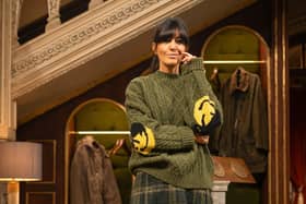 Claudia wears green cable jumper with smiley face elbows, £480 from Japanese menswear brand Kapital; kilt style skirt, £259, from Brora; and Dr Martens hi-top Chelsea boots, £180. From The Traitors II, Credit: BBC/Studio Lambert/LLARA PLAZA