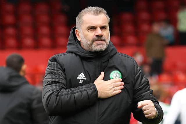 Ange Postecoglou pats the Celtic badge in front of the away fans at full-time. (Photo by Alan Harvey / SNS Group)