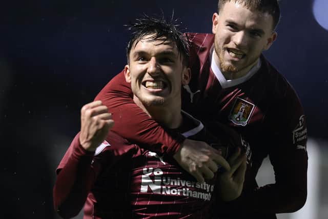 Current Hibs forward Kieron Bowie with Marc Leonard during their time at Northampton Town.