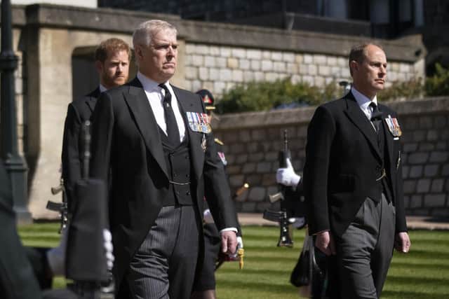 The Duke of York and the Earl of Wesex with Prince Harry walking in the procession at Windsor Castle
