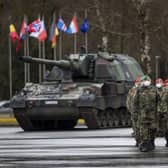 German Bundeswehr soldiers of the NATO enhanced forward presence battalion waits to greet German Defense Minister Christine Lambrecht upon his arrival at the Rukla military base on Tuesday, Feb. 22, 2022. Photo: AP Photo/Mindaugas Kulbis.