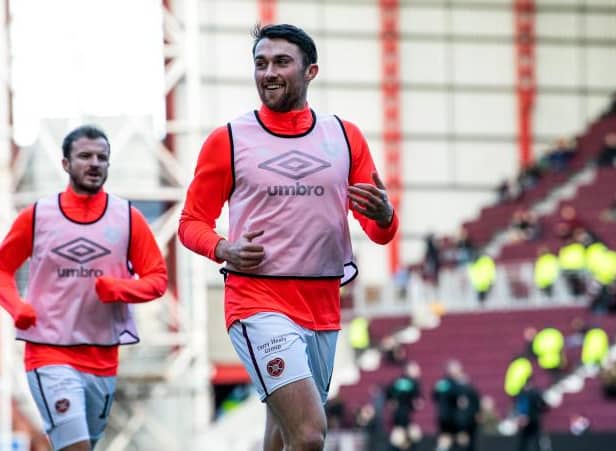 Hearts John Souttar warms up ahead of the match against Motherwell. (Photo by Ross Parker / SNS Group)