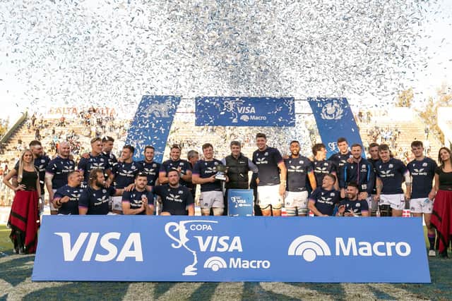 Scotland players celebrate with the trophy after defeating Argentina in the second Test in Salta. (Photo by Pablo Gasparini / AFP)