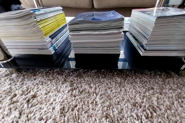 Piles of magazines or paperback books can also be useful to dampen the listening environment.