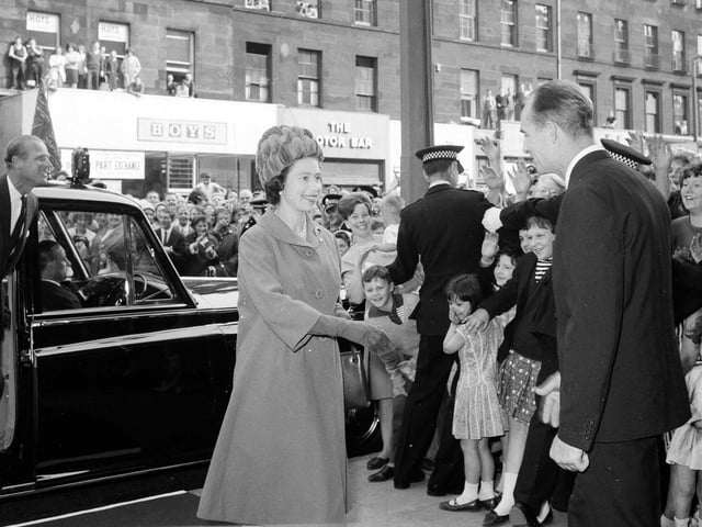 The Queen arrives at Edinburgh's ABC Cinema to see the film of the opening of the Forth Road Bridge in September 1964.