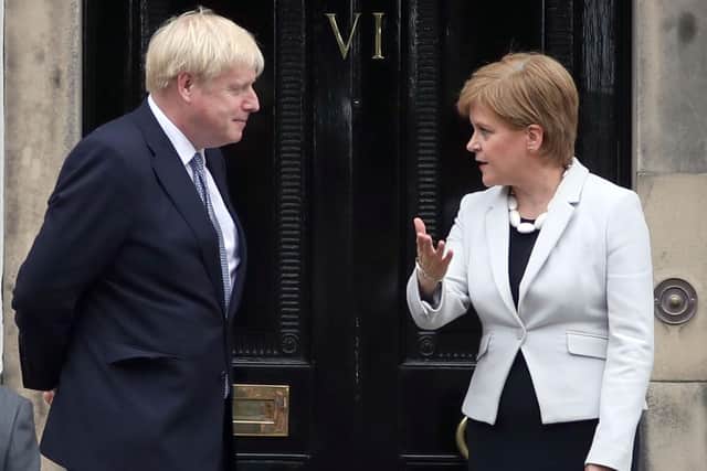 Can election campaign pledges by Nicola Sturgeon, seen with Boris Johnson outside Bute House in 2019, be trusted? (Picture: Jane Barlow/PA)