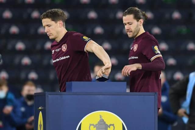 Hearts' Christophe Berra and Peter Haring collect runners-up medals after the William Hill Scottish Cup final (Photo by Craig Foy / SNS Group)