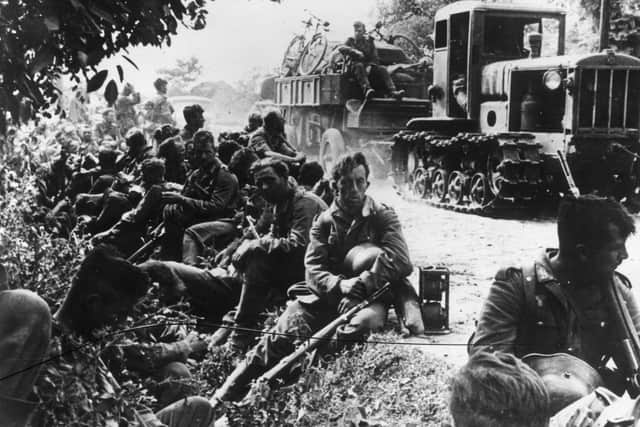 Summer 1941: Exhausted German soldiers resting by the roadside on the Eastern Front. PIC: Keystone/Getty Images