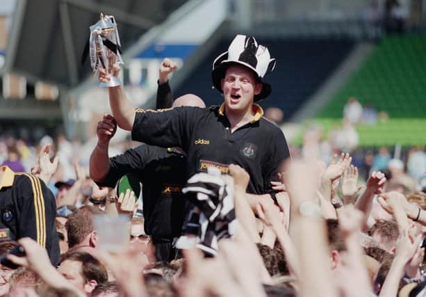 Doddie Weir is chaired off by Newcastle Falcons fans after helping the club win the Premiership title in 1997/98. Picture: Tom Shaw/Allsport/Getty Images/Hulton Archive