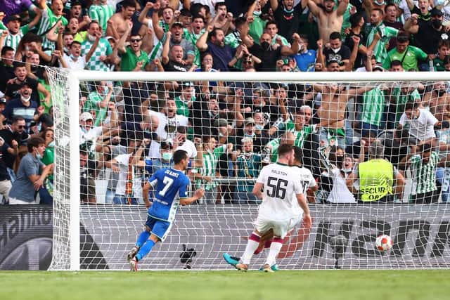 Juanmi of Real Betis scores their side's second goal during the UEFA Europa League group G match between Real Betis and Celtic FC at Estadio Benito Villamarin on September 16, 2021 in Seville, Spain. (Photo by Fran Santiago/Getty Images)