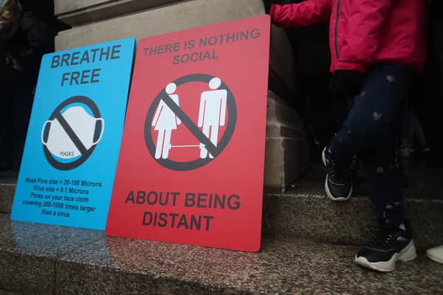 Signage at an anti-lockdown protest. Picture: Danny Lawson/PA Wire