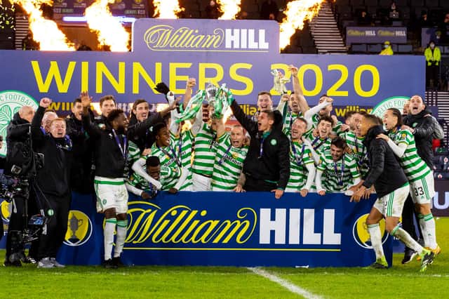 Scott Brown lifts the Scottish Cup as Celtic complete a quadruple treble in December's delayed 2019-20 final - with interim John Kennedy believing it will give a better 'vibe' that this year's competition is able to be squeezed in this season.(Photo by Alan Harvey / SNS Group)