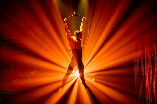 A performer from Briefs: Bite Club is caught in the spotlight