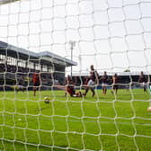 Hearts' Liam Boyce scores the opening goal during a cinch Premiership match between Dundee United and Hearts at Tannadice, on August 28, 2021.