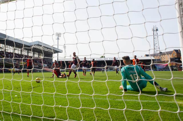Hearts' Liam Boyce scores the opening goal during a cinch Premiership match between Dundee United and Hearts at Tannadice, on August 28, 2021.