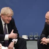 Boris Johnson and Vladimir Putin meet on the sidelines of a summit in Berlin in 2020 (Picture: Alexey Nikolsky/Sputnik/AFP via Getty Images)