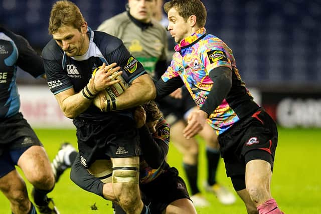 Glasgow's John Barclay is pursued by Edinburgh's Chris Paterson during an 1872 Cup match in January 2010. Picture: Craig Watson/SNS