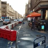 The temporary segregated cycle lane on Argyle Street is so narrow that cyclists could be forced onto the pavement. Picture: The Scotsman