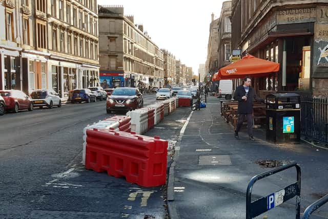 The temporary segregated cycle lane on Argyle Street is so narrow that cyclists could be forced onto the pavement. Picture: The Scotsman