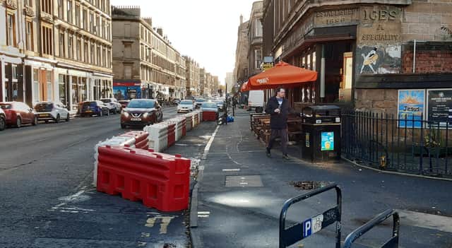The temporary segregated cycle lane on Argyle Street is so narrow that cyclists could be forced onto the pavement. Picture: The Scotsman