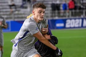 Georgetown's Dante Polvara, left, works past Washington's Gio Miglietti during the second half of an NCAA men's soccer tournament semi-final in Cary, N.C
NCAA Georgetown Washington Soccer, Cary, United States - 10 Dec 2021. Photo by Ben McKeown/AP/Shutterstock (12640370j)