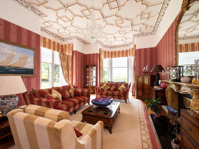 Original features include ornate ceilings.