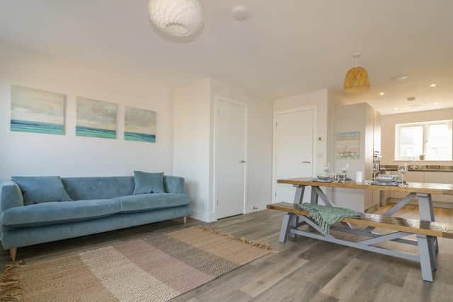 The Waves' open-planned living space with full kitchen and sociable relaxing and dining areas.