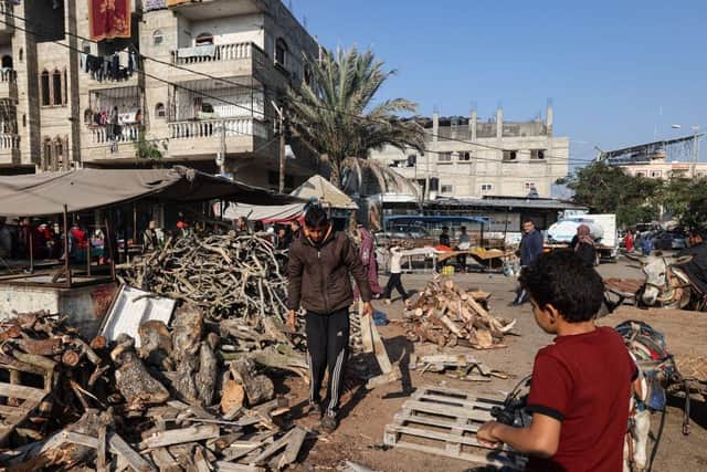 Palestinians prepare to sell wood in Rafah in the southern Gaza Strip, amid continuing battles between Israel and the militant group Hamas.