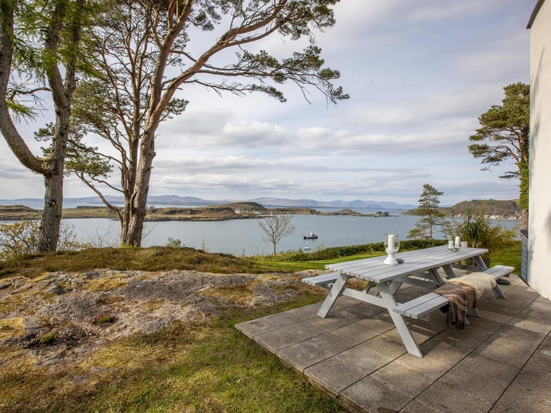 The patio area is ideal for watching the boats sail along the water