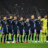 Scotland's players stand during the national anthem ahead of the FIFA World Cup Qatar 2022 Group F qualification football match between Scotland and Israel at Hampden Park in Glasgow on october 9, 2021. (Photo by ANDY BUCHANAN/AFP via Getty Images)
