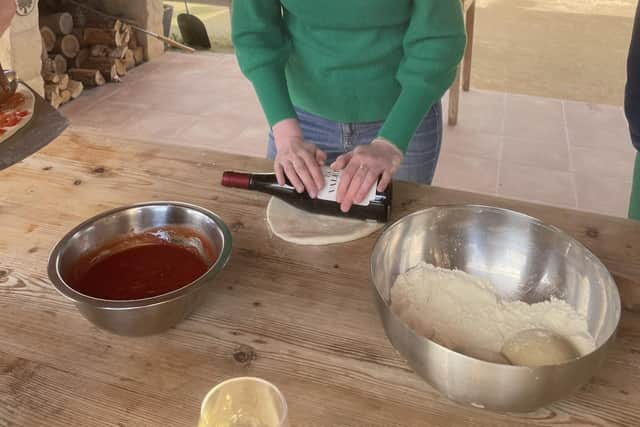 Rolling out dough to make ftira. Pic: Aine Fox/PA.