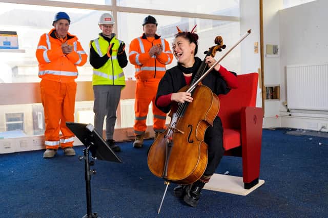 Cellist Su-a Lee staged a short performance for construction workers as work began on the site of Edinburgh's new Dunard Centre concert hall.