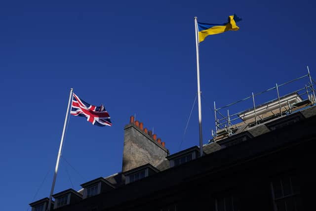 The Ukrainian flag being flown above 10 Downing Street in London,