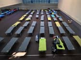 A Ukrainian war refugee sits on a camp bed in a sports hall in the small Bavarian village of Eichenau near Munich, southern Germany. Picture: Christof Stache/AFP via Getty Images