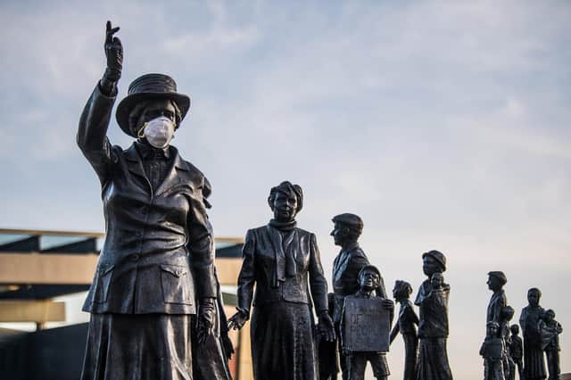 The world is now a place where statues, like Mary Barbour in Glasgow, wear masks and humans seldom venture outside (Picture: John Devlin)