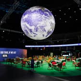 The Earth hangs over an empty Action Zone in the OVO Hydro building during the COP26 summit in Glasgow last year