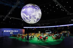 The Earth hangs over an empty Action Zone in the OVO Hydro building during the COP26 summit in Glasgow last year