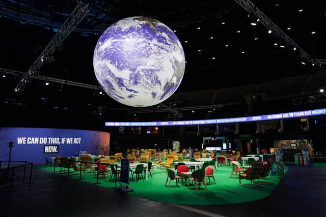 The Earth hangs over an empty Action Zone in the OVO Hydro building during the COP26 summit in Glasgow last year