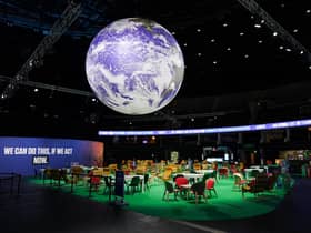 The Earth hangs over an empty Action Zone in the OVO Hydro building during the COP26 summit in Glasgow last year