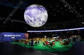 The Earth hangs over an empty Action Zone in the OVO Hydro building during the COP26 summit in Glasgow last year