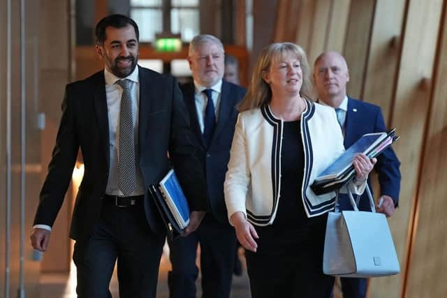 First Minister Humza Yousaf and Finance Secretary Shona Robison on their way to the Holyrood debating chamber to deliver the 2024/25 Scottish budget. Image: Andy Buchanan/Getty Images.