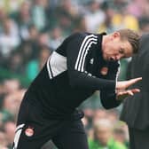 Barry Robson tries to rally his Aberdeen team during the 5-0 defeat by Celtic.