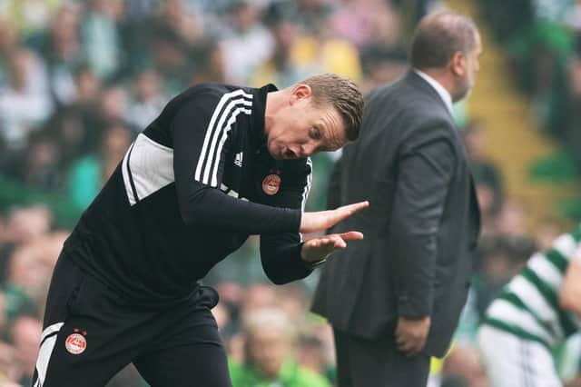 Barry Robson tries to rally his Aberdeen team during the 5-0 defeat by Celtic.