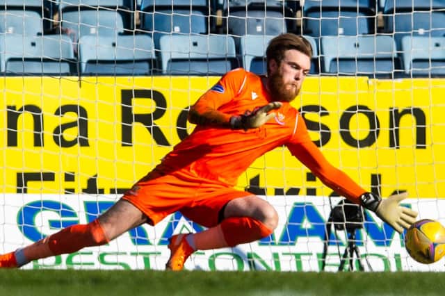 St Johnstone 'keeper Zander Clark turns Dundee skipper Charlie Adam's penalty onto the post in the Perth side's 1-0 victory (Photo by Craig Foy / SNS Group)