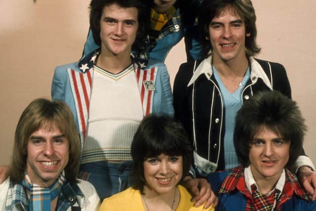 Bay City Rollers founding member Alan Longmuir with other band members and Sally James during an appearance on Saturday Scene in 1974