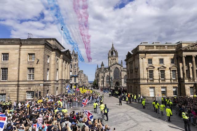 The Red Arrows perform a fly past over the Royal Mile for the National Service of Thanksgiving and Dedication for King Charles III and Queen Camilla. Picture: Jamie Williamson/Daily Mail/PA Wire