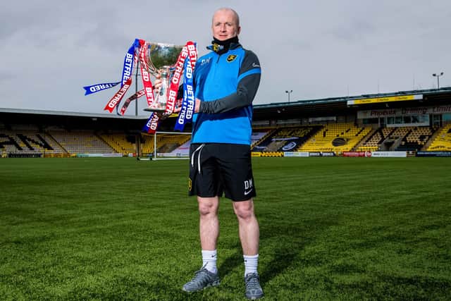 Livingston manager David Martindale holds the Betfred Cup prior to Sunday's final against St Johnstone. He revealed he will not be wearing a suit (Photo by Ross Parker / SNS Group)