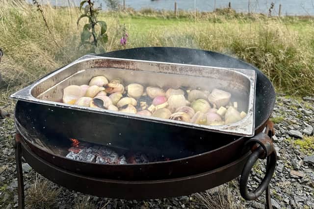 Cooking over an open fire has become a popular element of wild dining experiences.