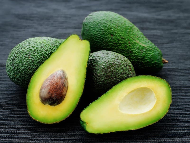 Avocados comatin persin which is toxic for dogs. Most of the substance is concentrated in the leaves, skin and pit of the fruit, but it is also present in small amounts in the flesh. Symptoms include vomiting, diarrhea, and myocardial damage.
